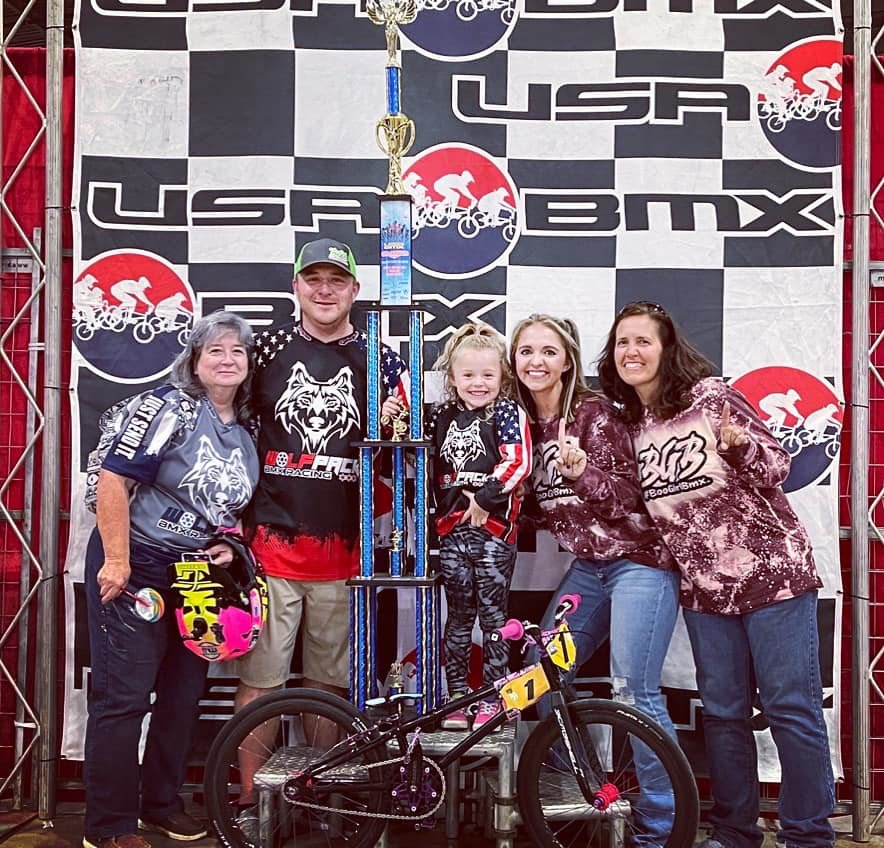 Carolyn Greer, Jimmy Green, Henley Greer, Elizabeth Greer and Elizabeth's mother, Jennifer Ratcliff, pose with Henley's national BMX trophy after she claimed the USA BMX girls 5-years-old and under title in Tulsa, Oklahoma, last month.